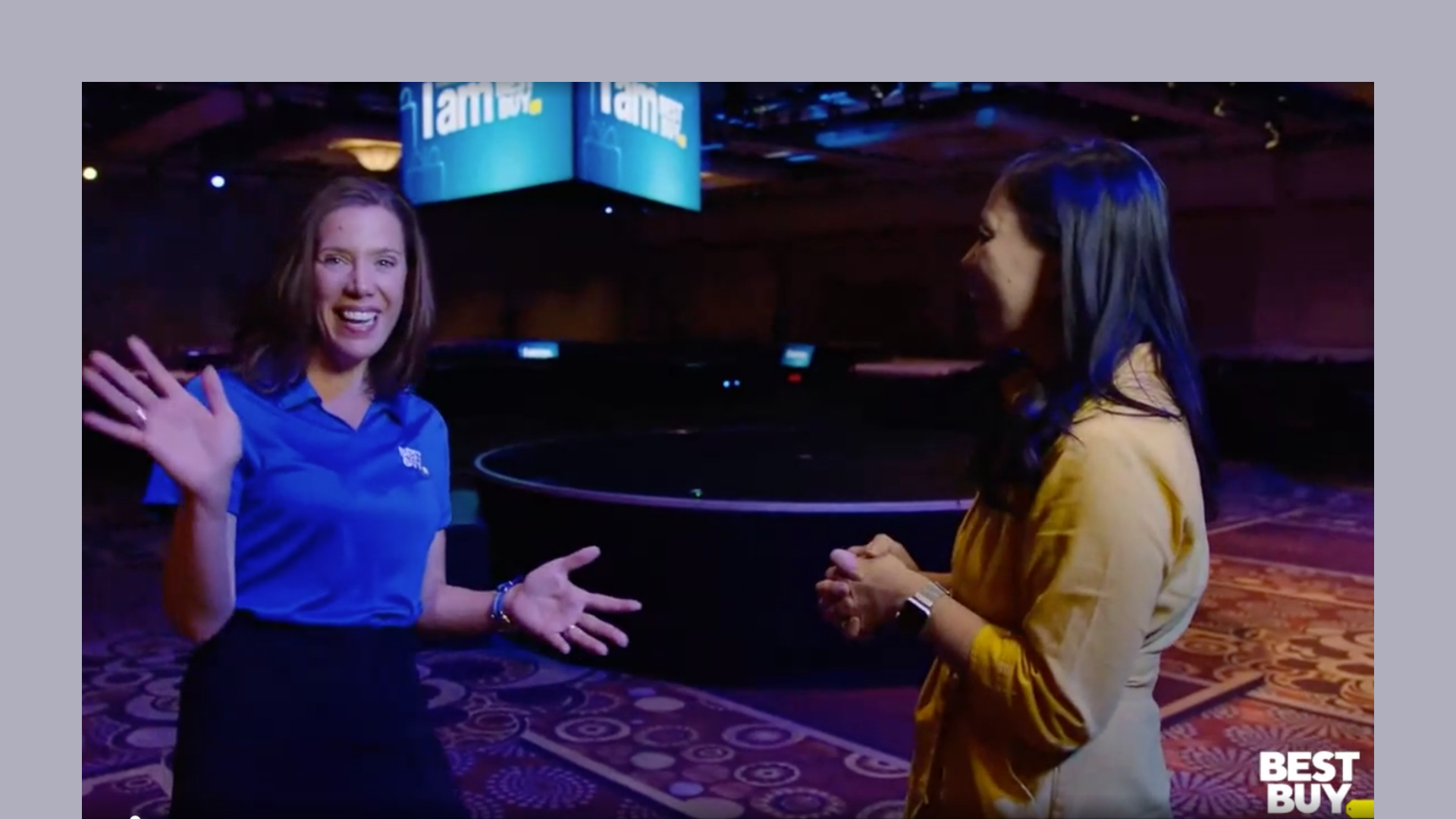 People talking at a Best Buy conference People talking at a Best Buy conference