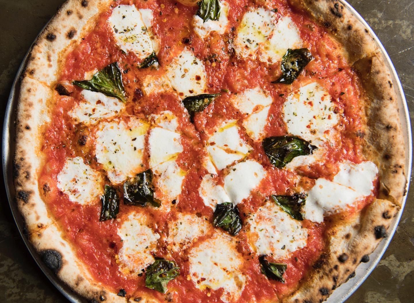 This New York City hotspot is known for their wood-fired pizza pies. The mouth-watering anthem video from their website shows prospective diners why. This New York City hotspot is known for their wood-fired pizza pies. The mouth-watering anthem video from their website shows prospective diners why.
